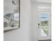 Bright entryway with a modern framed print and glass door at 5259 Salt Marsh Rd, Wimauma, FL 33598