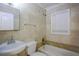 Clean bathroom with a bathtub, sink, and tiled walls at 540 Newton S Ave, St Petersburg, FL 33701