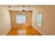 Bright bedroom with wood floors and two windows at 540 Newton S Ave, St Petersburg, FL 33701