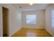 Bedroom with hardwood floors, window, and closet at 540 Newton S Ave, St Petersburg, FL 33701