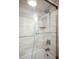 Shower with glass enclosure and wave patterned tile at 5940 Pelican Bay S Plz # 1106, Gulfport, FL 33707