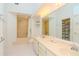 Bathroom features double vanity, shower and built-in shelving at 6059 Bahia Del Mar Blvd # 233, St Petersburg, FL 33715