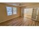 Bright living room with hardwood floors and French doors leading to a sunroom at 617 Newton S Ave, St Petersburg, FL 33701