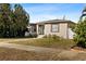 House exterior showcasing a manicured lawn and updated facade at 6559 3Rd S Ave, St Petersburg, FL 33707