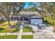 Single story home with a large yard and driveway at 1040 31St E St, Palmetto, FL 34221