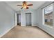 Bedroom with light walls, neutral carpeting, and a ceiling fan at 1040 31St E St, Palmetto, FL 34221
