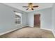 Spacious bedroom with ceiling fan and carpet flooring at 1040 31St E St, Palmetto, FL 34221