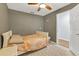 Simple bedroom with ceiling fan and neutral decor at 1040 31St E St, Palmetto, FL 34221
