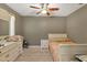 Cozy bedroom with ceiling fan and neutral decor at 1040 31St E St, Palmetto, FL 34221