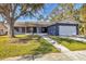Ranch style home with a two-car garage and mature landscaping at 1040 31St E St, Palmetto, FL 34221