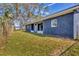 Newly renovated house exterior with blue siding and spacious backyard at 1040 31St E St, Palmetto, FL 34221