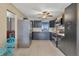 Galley kitchen with dark cabinets and stainless steel appliances at 1040 31St E St, Palmetto, FL 34221