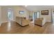 Open living room with hardwood floors and view of bathroom at 1040 31St E St, Palmetto, FL 34221