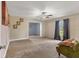 Spacious living room with neutral carpeting and a cozy sitting area at 1040 31St E St, Palmetto, FL 34221