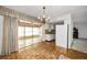 Bright dining area with chandelier and kitchen access at 11944 Orange Blossom Dr, Seminole, FL 33772