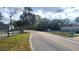 Residential street view with trees and homes at 12403 Banbury Ave, New Port Richey, FL 34654