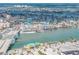 Aerial view of coastal town with bridge, waterfront, and beach at 12412 Lagoon Ln, Treasure Island, FL 33706