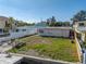 Aerial view of a single story home with a large backyard, close to the water at 12412 Lagoon Ln, Treasure Island, FL 33706