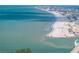 Aerial view of beach, ocean, and coastal city at 12412 Lagoon Ln, Treasure Island, FL 33706