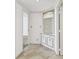 Hallway featuring built in storage with decorative doors and tile floor at 1501 Gulf Blvd # 604, Clearwater Beach, FL 33767