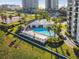 Aerial view of pool area with lounge chairs and landscaping at 1501 Gulf Blvd # 604, Clearwater Beach, FL 33767