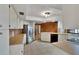 Kitchen with stainless steel appliances and wood-paneled accent wall at 1903 Country Club Ct, Plant City, FL 33566