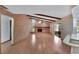 Living room with wood floors, brick fireplace, and high ceilings at 1903 Country Club Ct, Plant City, FL 33566