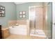 Bathroom features a large walk in shower and garden tub at 3148 Macintosh Rd, Land O Lakes, FL 34639