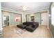 Living room with sectional sofa and access to other rooms at 3148 Macintosh Rd, Land O Lakes, FL 34639