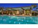 Community lap pool with adjacent covered seating and lounge area at 34064 Tompion Way, Wesley Chapel, FL 33543