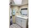 Updated bathroom with white vanity, new tile floor, and skylight at 37210 Bermont Rd, Punta Gorda, FL 33982