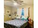 Bedroom with floral bedding and ceiling fan at 37210 Bermont Rd, Punta Gorda, FL 33982