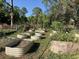 Backyard garden with raised garden beds and various plants at 37210 Bermont Rd, Punta Gorda, FL 33982