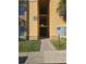 Well-lit building entrance with paved pathway, landscaping, and address marker at 4333 Bayside Village Dr # 125, Tampa, FL 33615