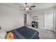 Bedroom with double bed and adjacent hallway at 5035 Suncatcher Dr, Wesley Chapel, FL 33545