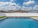 Modern rectangular pool with stone feature and waterfall at 5035 Suncatcher Dr, Wesley Chapel, FL 33545