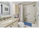 Updated bathroom with a walk-in shower and granite countertop at 6180 Sun Blvd # 201, St Petersburg, FL 33715