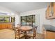 Casual dining area with pool view, and wood table and chairs at 902 Flatwood Ct, Brandon, FL 33511