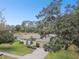 Aerial view of single-Gathering home with driveway and landscaping at 970 Rolling Hills Dr, Palm Harbor, FL 34683