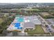 Community center, pools, tennis courts, playground, large parking lot at 970 Rolling Hills Dr, Palm Harbor, FL 34683