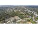 Wide aerial view of neighborhood, highlighting the community setting and nearby amenities at 970 Rolling Hills Dr, Palm Harbor, FL 34683