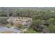 Aerial view showcasing house location on a tree-lined street at 970 Rolling Hills Dr, Palm Harbor, FL 34683