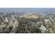 Aerial view showing neighborhood, park, and tennis courts at 970 Rolling Hills Dr, Palm Harbor, FL 34683