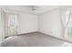 Bedroom with ceiling fan, window, and closet at 970 Rolling Hills Dr, Palm Harbor, FL 34683