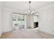 Bright dining room with sliding glass doors to the outside at 970 Rolling Hills Dr, Palm Harbor, FL 34683