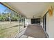Spacious screened porch overlooking backyard at 970 Rolling Hills Dr, Palm Harbor, FL 34683