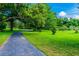 Enjoy a relaxing stroll on the paved path at 970 Rolling Hills Dr, Palm Harbor, FL 34683