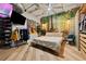 Spacious bedroom with closet, hardwood floors, and a forest mural at 101 N 12Th St # 207, Tampa, FL 33602