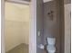 Small bathroom with toilet and access to a large closet at 10212 Grant Creek Dr, Tampa, FL 33647