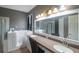 Elegant bathroom with a walk-in shower and double vanity at 10212 Grant Creek Dr, Tampa, FL 33647